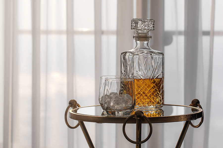 whiskey decanter and glasses on stand