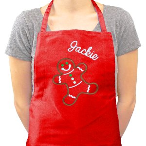 Nothing says "Christmas" like the gingerbread man#44; and Personalized Christmas Aprons will absolutely put her in the holiday spirit. She'll love the embroidered touch on this item#44; and she'll be excited to wear it as she gets to work preparing some of your favorite Christmas cookies. This custom bib apron measures 20 Wide x 30 Tall and features multiple pockets for convenient storage along with an adjustable neck strap for a comfortable fit. Personalization of any name is included. This is one gift that will have her excited to get to baking during the holidays.
